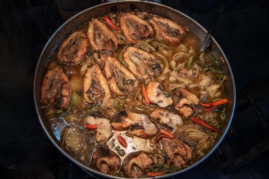 Snake head fish belly with pickle mustard soup. Chinese style. Oblique view from the top, Selective focus.