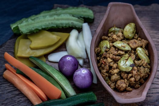 Thai food,  Southern Thai dry curry with ground pork Khua Kling, Thai dry curry with ground pork with Herbs vegetables, Oblique view from the top.