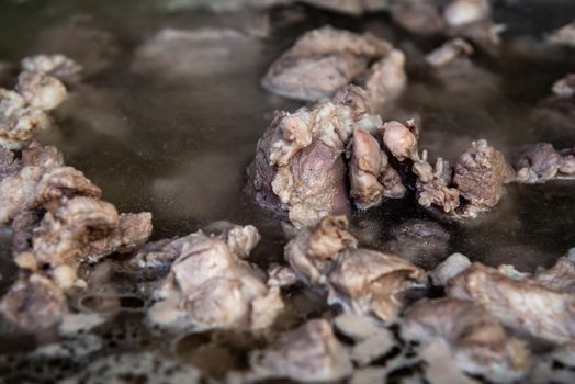 Closeup of Boiling pork rip soup in hot in pot boiling water, Soup of pork rips, Selective focus.