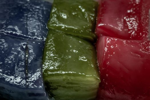 Close-up of Kind of Thai sweetmeat or Thai dessert : Multi Layer Sweet Cake or Steamed Layer Sweet Cake (Kanom Chan) Thai traditional dessert One of nine famous Thai auspicious desserts in Thailand, Selective focus.