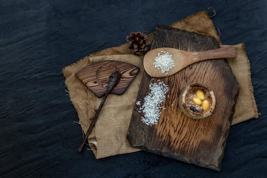 Sticky Rice Cooked with Coconut milk (Khao lam) or Glutinous rice roasted in bamboo joints on wooden, Thai dessert concept, Top view.