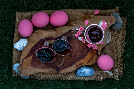 Asian Traditional Food, Pink Century eggs (Pidan Eggs) also known as preserved egg, hundred-year egg, thousand-year egg are a Chinese preserved food product and delicacy made by preserving duck, chicken in A Mixture of Ash, Salt, Red Lime, Sodium Carbonate, Tea Leaves and Zinc Oxide, Selective focus.