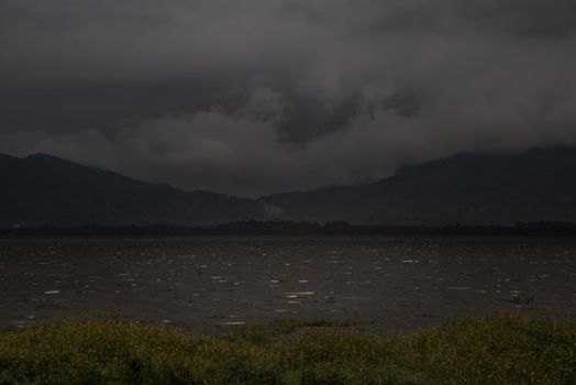 The beauty of Bang Phra Reservoir on the background of misty capped mountains, Chonburi Province, Thailand