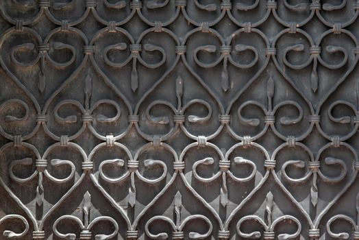 ornate wrought-iron elements of metal gate decoration. copy space.