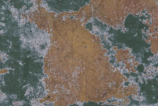 Beautiful patterns on the Old plastered field with falling off flakes of paint. Texture, background, different color patterns, copy space.
