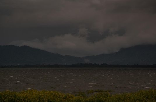 The beauty of Bang Phra Reservoir on the background of misty capped mountains, Chonburi Province, Thailand