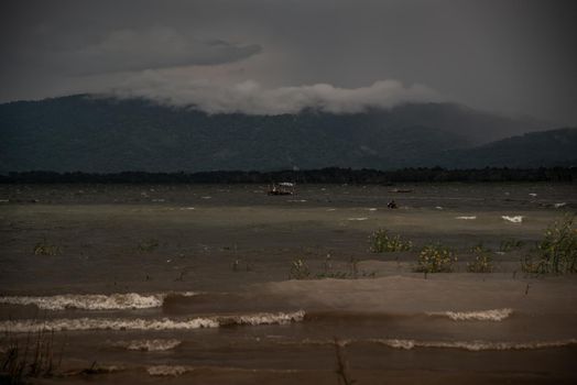 The beauty of Bang Phra Reservoir on the background of misty capped mountains, Chonburi Province, Thailand