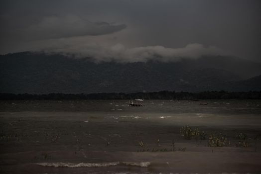 The beauty of Bang Phra Reservoir on the background of misty capped mountains, Chonburi Province, Thailand