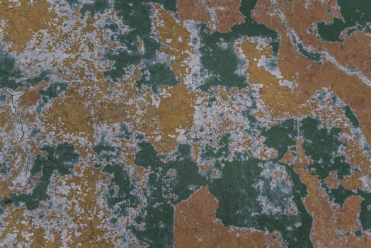 Beautiful patterns on the Old plastered field with falling off flakes of paint. Texture, background, different color patterns, copy space.