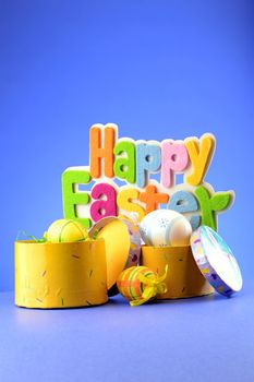 A festive holiday scene with the words saying Happy Easter over a blue background.