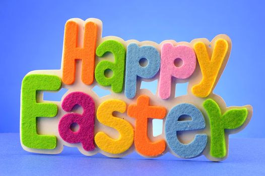 A happy Easter sign over a blue background.