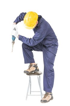 Young handyman in unifrom standing with his electric drill, Cutout isolated on white background with clipping path