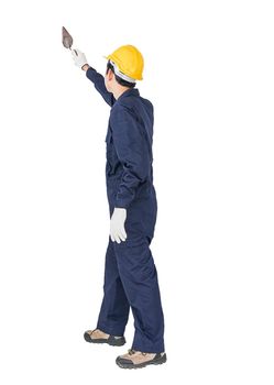 Portrait of a workman with blue coveralls and hardhat in a uniform holding steel trowel on white background with clipping path