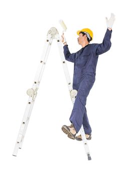 Young handyman in uniform standing on ladder while using paint roller, Cutout isolated on white background with clipping path