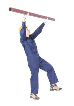 Young plumber in uniform holding pvc pipe isolated on white background  with clipping path