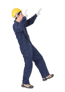 Portrait of a workman with blue coveralls and hardhat in a uniform on white background with clipping path