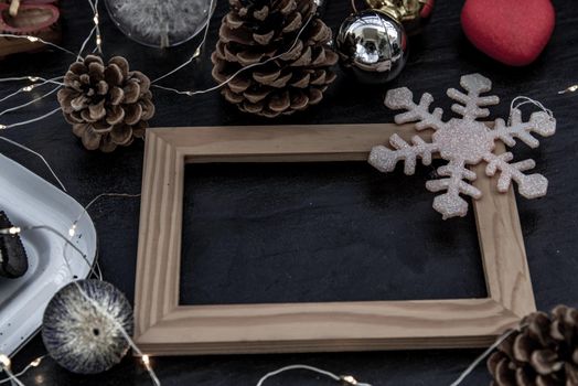 Christmas decoration with Empty wooden frame for work about design element.  Selective focus, Oblique view from the top, copy space