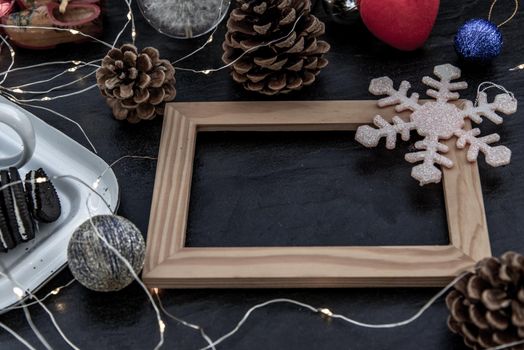 Christmas decoration with Empty wooden frame for work about design element.  Selective focus, Oblique view from the top, copy space