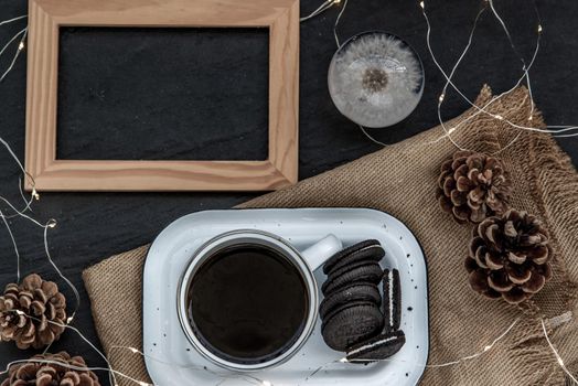 Cup of coffee with chocolate chip cookies on wooden tray. Concept for a tasty snack, Selective focus, Top view.