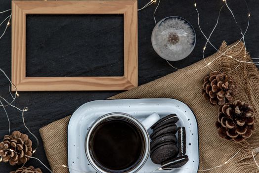 Cup of coffee with chocolate chip cookies on wooden tray. Concept for a tasty snack, Selective focus, Top view.