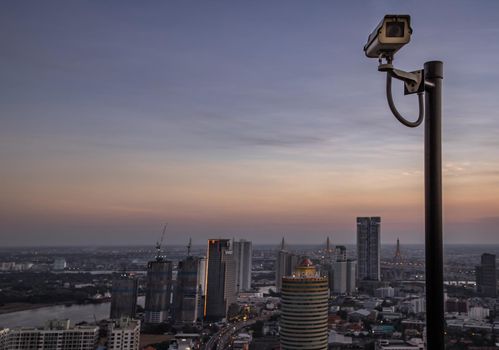 Bangkok, thailand - Mar 06, 2020 : Modern surveillance cameras on the cityscape background wall, the concept of surveillance and visual inspection that has been developed. Selective focus.