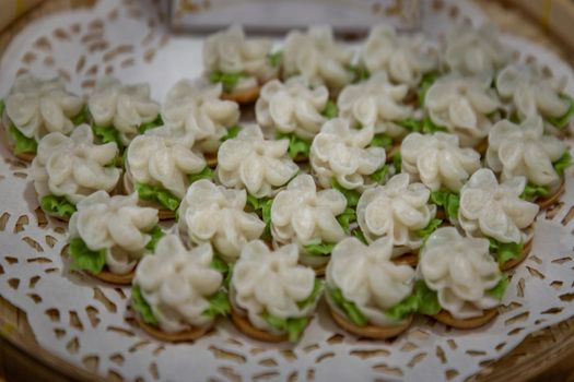 Traditional Thai desserts sweet and delicious : Candy with Jasmine shaped. "A-lua or Allure" Thai handmade candy.