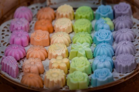 Thai coconut cookies or Khanom Sam Pan Nee, Thai dessert, Made of tapioca flour, coconut cream and sugar serving in a Bamboo basket hand made.