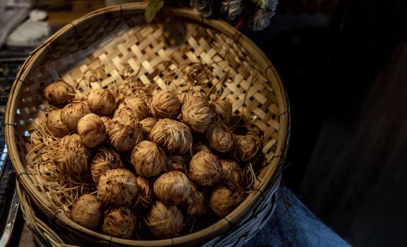 Deep Fried Wrapped Pork with Chinese Noodle or Fried pork ball with noodle or Moo Sarong serving on a Bamboo basket hand made, Authentic recipes, classical Thai cuisine.