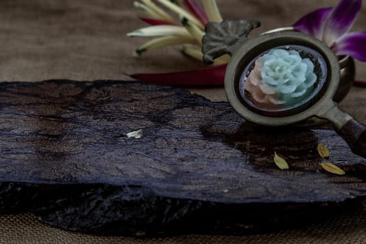 Traditional Thai desserts sweet and delicious : Thai Layer Sweet Cake or Kanom Chan desserts that made in various flower pattern such as roses, copy space.