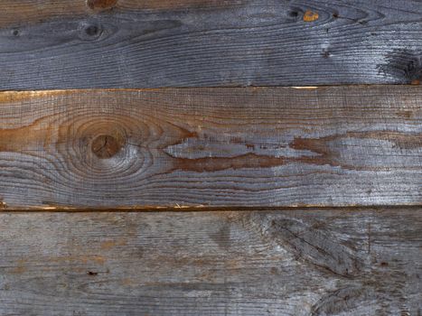 Wall of old dark wooden planks.