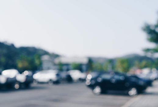 Blur car park with many cars abstract background. Vintage tone color.