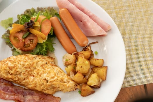 American breakfast set on old wood vintage table background.