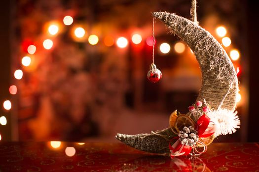 Christmas card. New Year background with bokeh and month. Christmas tree toy.