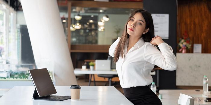 Portrait of business female having rest while situating at table in apartment. Job and leisure concept