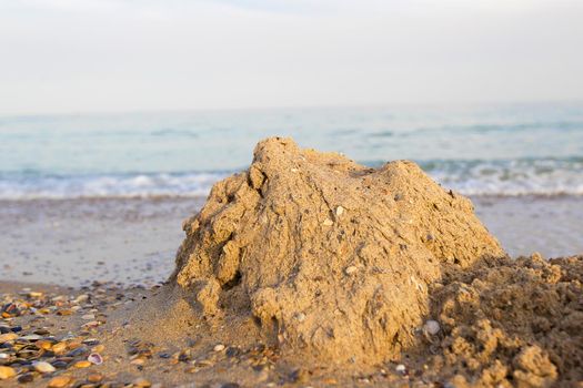 Sand castle on the beach of the sea