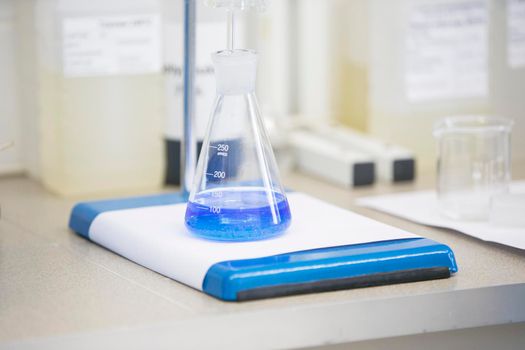 Flask with blue liquid in lab