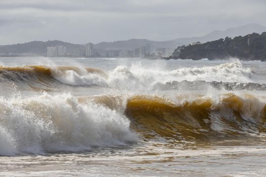 Powerful ocean wave breaking ina windy day in Spanish town Palamos in Costa Brava