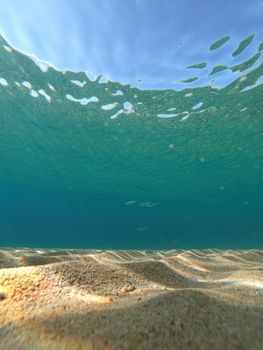 Transparent blue sea water in Spanish Costa Brava, vertical picture