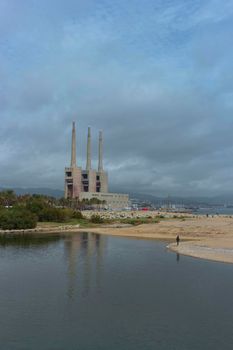 Landscape with an old disused thermal power station for the production of electric energy in Barcelona Spain
