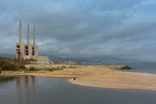 Landscape with an old disused thermal power station for the production of electric energy in Barcelona Spain