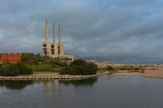 Landscape with an old disused thermal power station for the production of electric energy in Barcelona Spain