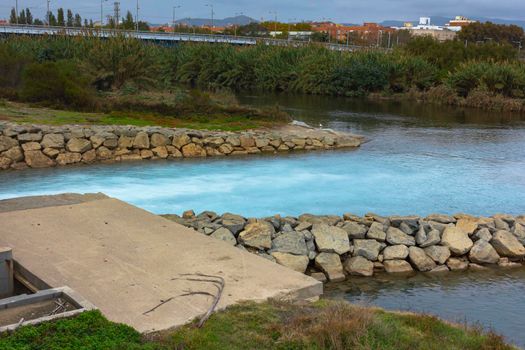 Wastewater outlet from the thermal power plant to a river in Barcelona, Spain