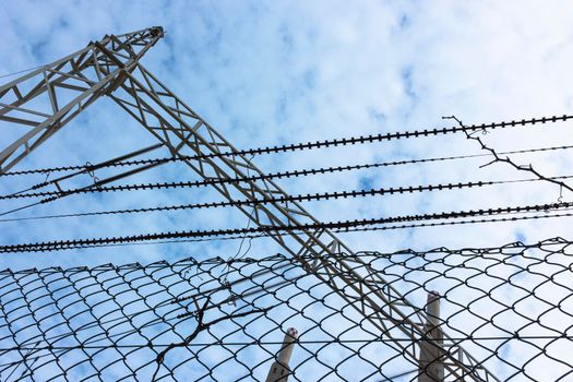 Old disused thermal power plant for the production of electricity in Barcelona behind a metal fence in Barcelona Spain