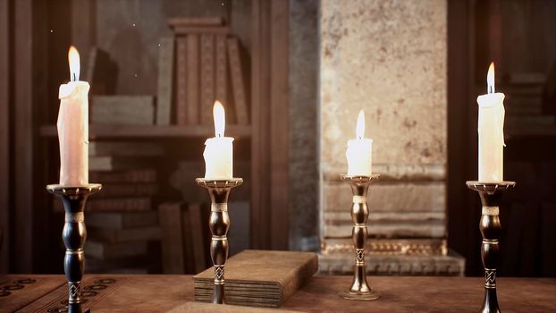 Candles on the table of an alchemist in a medieval ancient castle. View of the ancient castle and the candles.