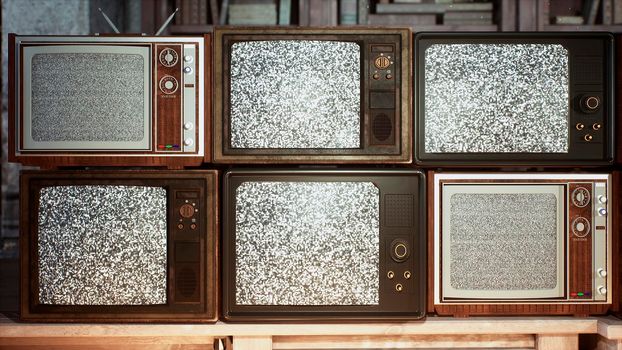 Several vintage TVs in an old building. TVs from the 70s and 80s, retro TVs with poor signal reception. Old televisions on an old table. Retro vintage atmosphere.
