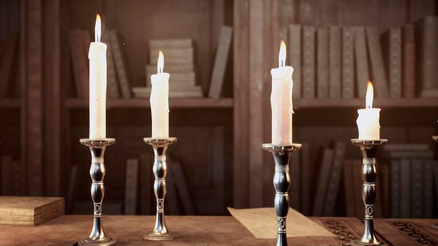 Candles on the table of an alchemist in a medieval ancient castle. View of the ancient castle and the candles.