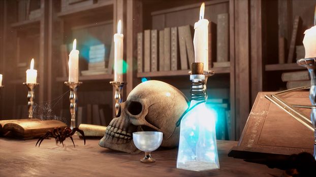 A skull and a manuscript with spells lie on the ancient table of the alchemist. View of the ancient alchemist's table.