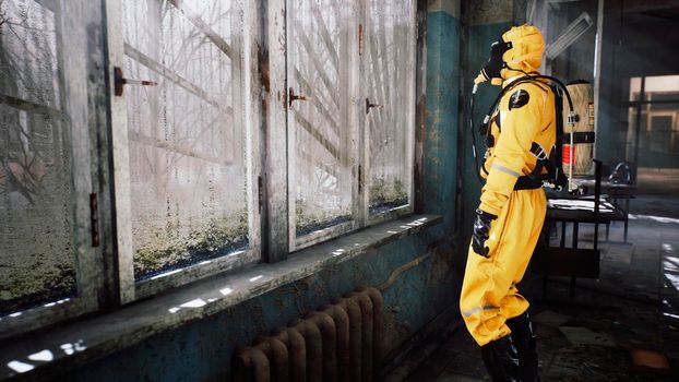 The last survivor of a nuclear war or a deadly viral pandemic stands in the morning at the window in a destroyed building. Post-apocalyptic world concept. View of an abandoned apocalyptic building.