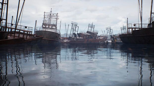 Rusty abandoned ships in the sea bay. Destroyed abandoned industrial ships.