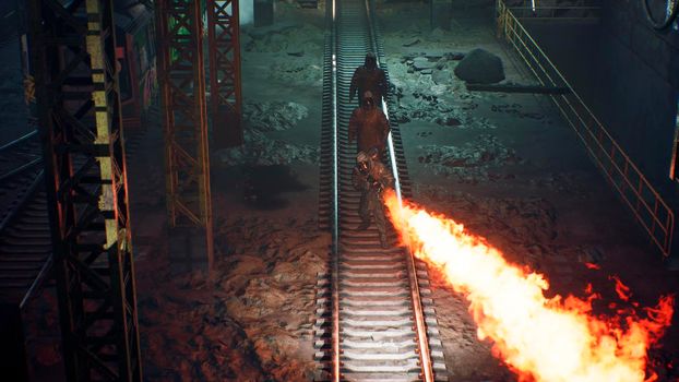 Stalkers in military chemical protective clothing and a gas mask are walking along an abandoned subway with a flamethrower. The concept of a post-apocalyptic world after a nuclear war.